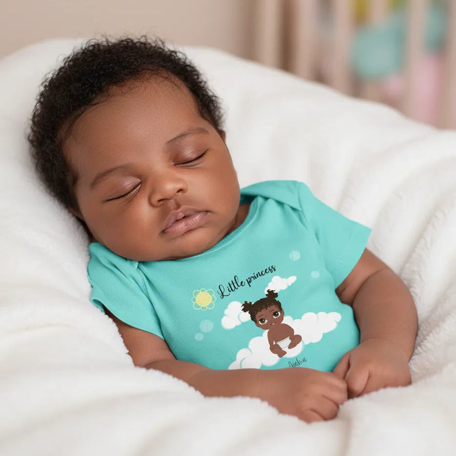 Baby wearing a turquoise onesie Personalized Little Prince or Princess baby bodysuit with custom baby character, name, and gentle themed background, lying on a white blanket.