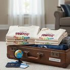 Custom family photo baby onesie with automatic background removal and personalized text, all ready for the next family trip, suitcase is packed.